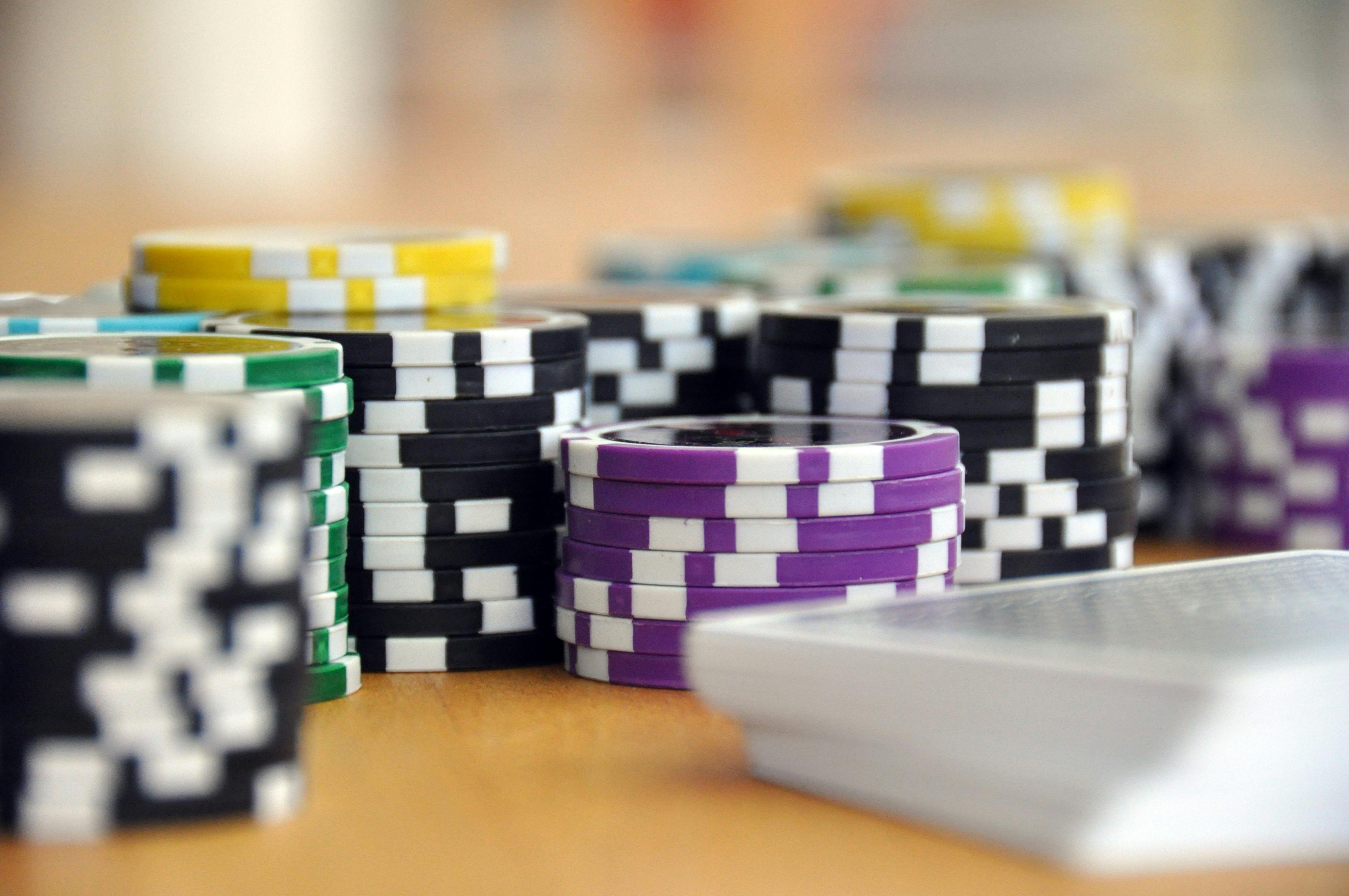 Mobile phone displaying Fortune Tiger in fullscreen with adjustable bet controls and spin button